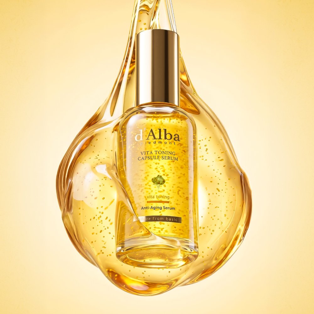 d'Alba Vita Toning serum bottle inside a golden droplet