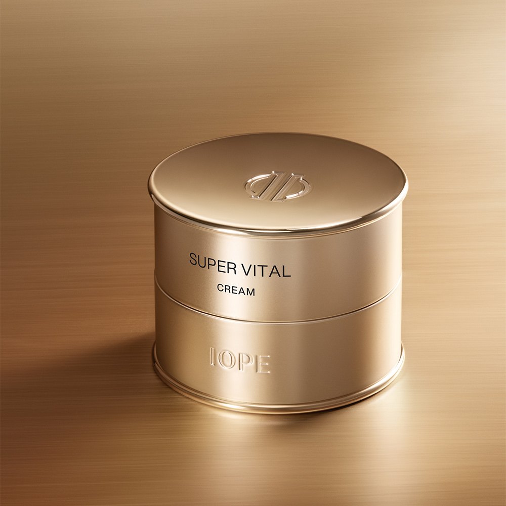 IOPE Super Vital Cream jar on a warm gold background